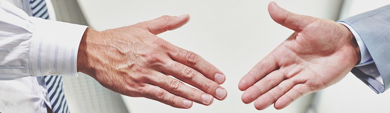 shaking hands to symbolise the finalization of an agreement