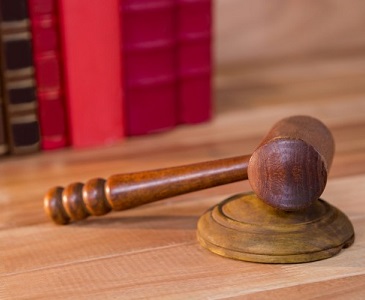 hammer on a table, symbolising the finality of a legal decision